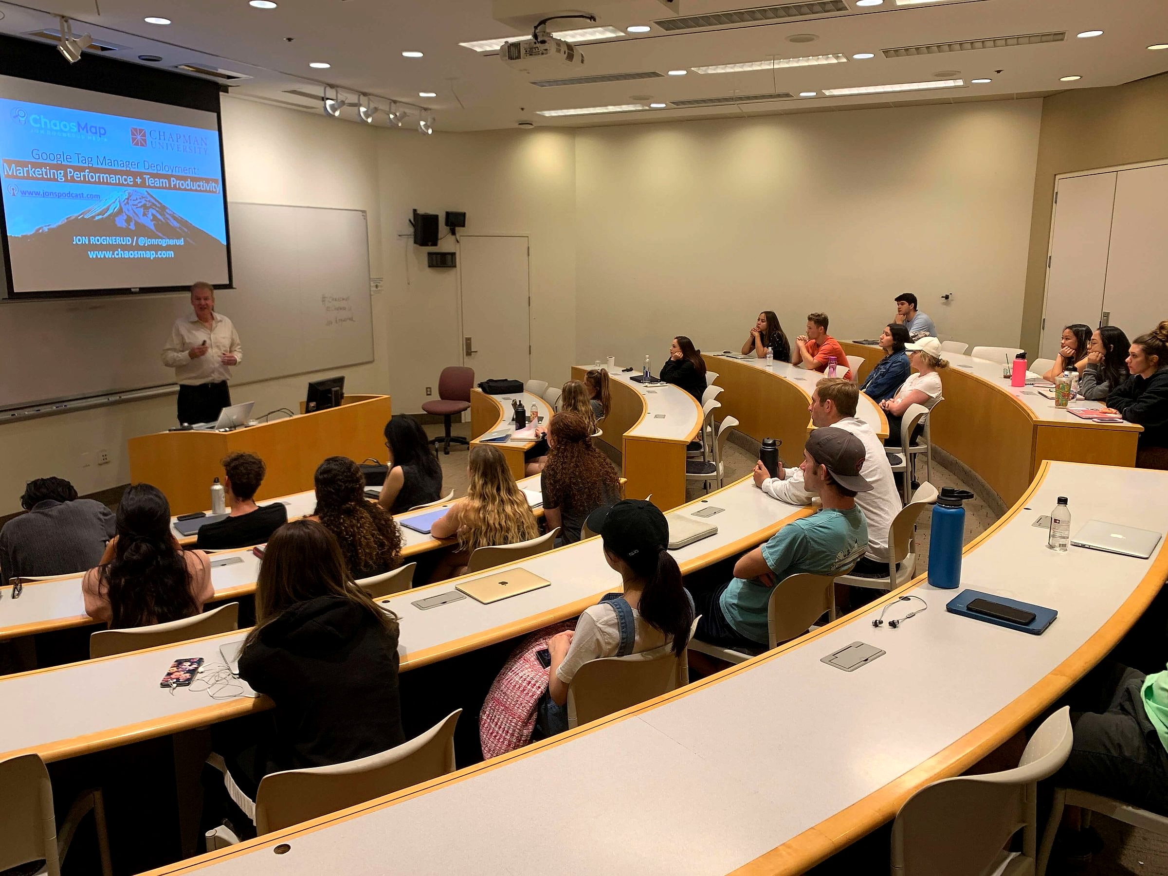 Jon Rognerud presenting to a full classroom