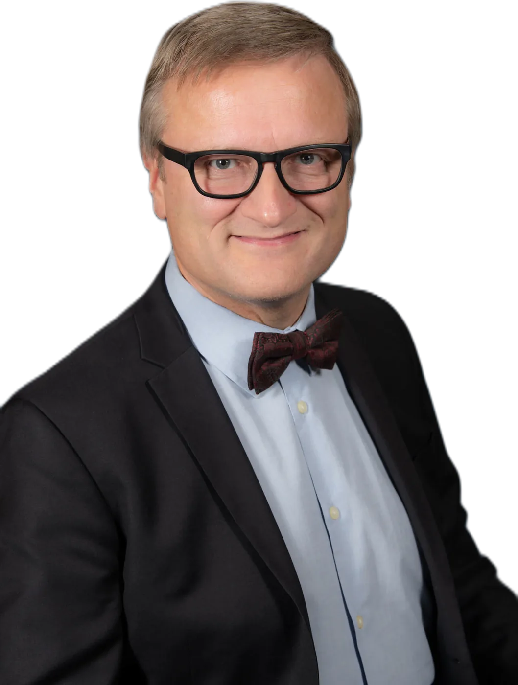 Niklas Myhr in a dark suit, light blue shirt and patterned bow tie