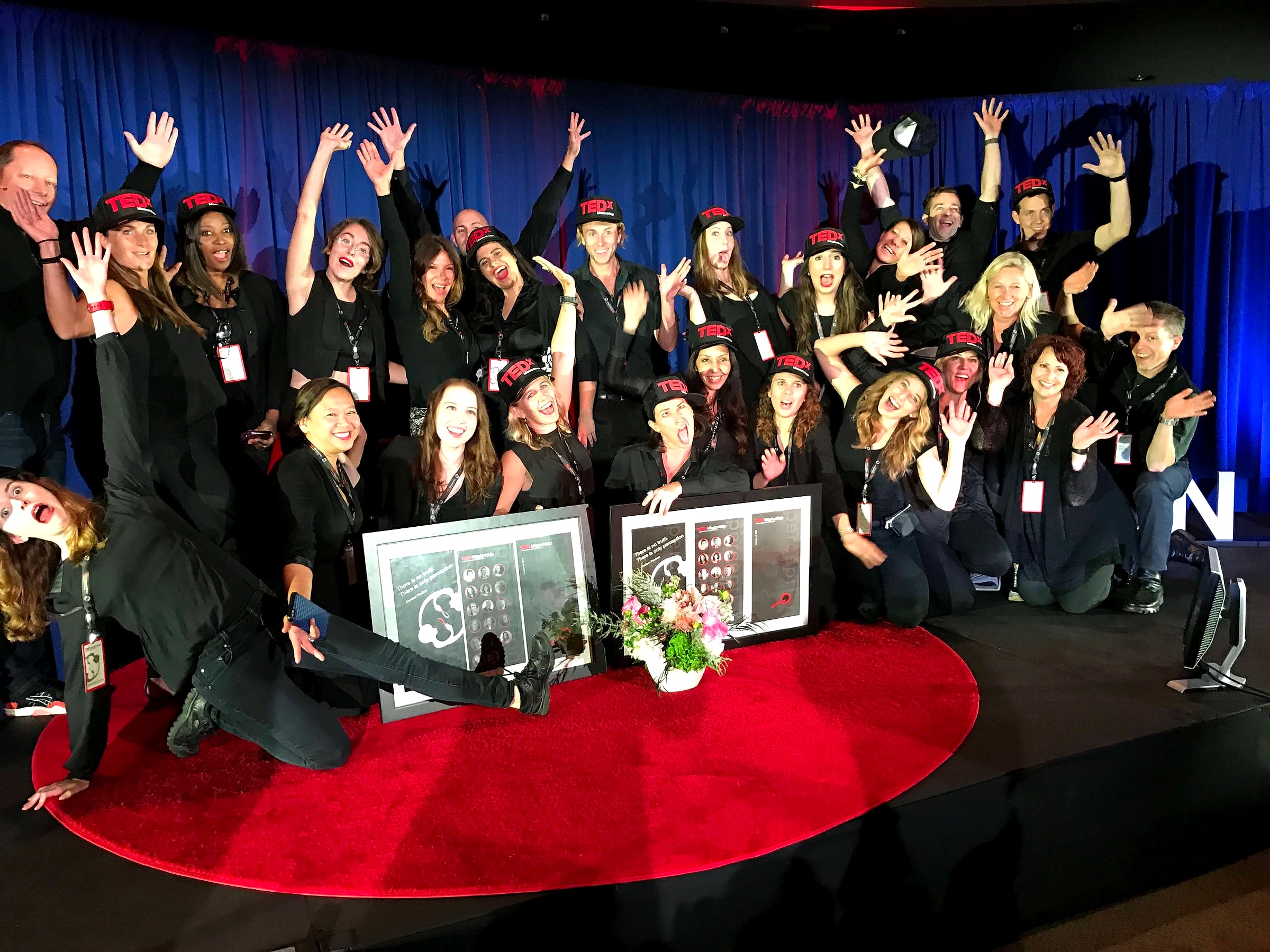 TEDxMissionViejo volunteers, including his Chapman students, on the red circle